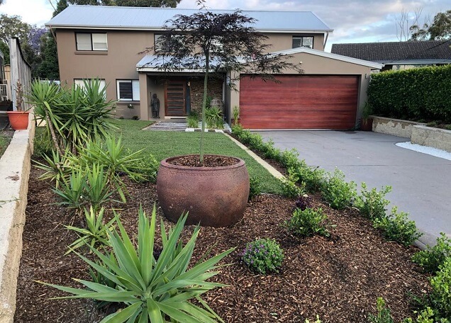 Absolute Tree and Garden Services team working on a landscaping project